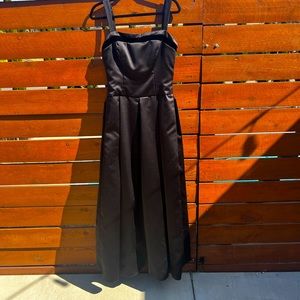 Beautiful black dress with black velvet trim around top. No tags, but size 8.